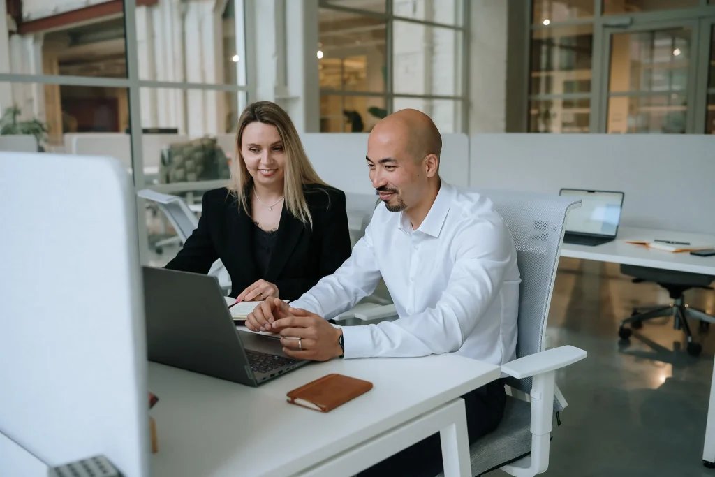 HubSpot consultants discussing CRM implementation during a client consulting session.